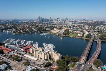 Sydney suburb of Drummoyne, city skyline and Parramatta river and Iron cove bridge. - 785943148