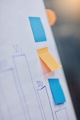 Sticky note, data and board with graph, business or planning in office with bokeh. Paper, closeup...