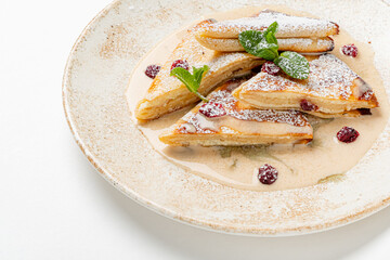pancakes with sweet sauce and mint