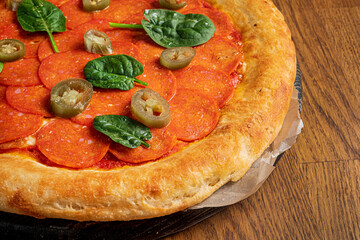 italian pizza on the wooden background