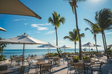 Fototapeta na wymiar A beachside café with panoramic ocean views, palm trees swaying in the breeze, and umbrella-shaded tables offering a relaxed coastal vibe, Generative AI