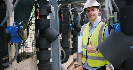 Portrait handsome Caucasian civil engineer Construction manager worker inspector foreman in safety helmet looking at camera showing thumbs up and Smiling at construction site