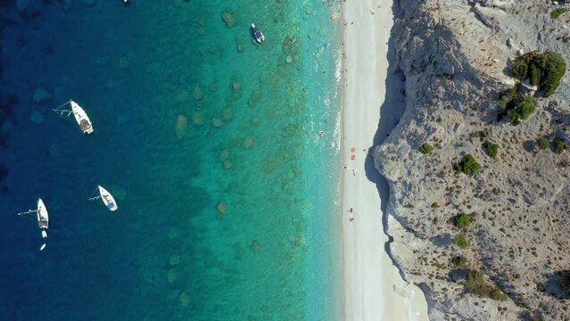 Aerial: Top down drone shot of Lalaria beach in Skiathos island, Sporades, Greece with turquoise  water