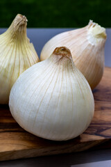 Obraz premium White sweet doux french salad onions vegetables on food market close up