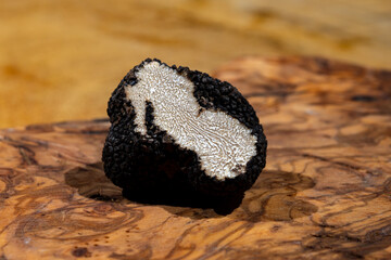 Cooking pasta with Italian black summer truffle, tasty aromatic mushroom, close up