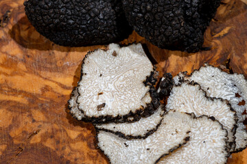 Slices of Italian black summer truffle, tasty aromatic mushroom, close up