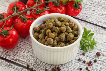 Marinated green capers in the bowl