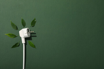 White electric cable with fresh green leaves