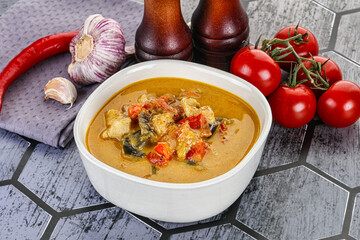 Traditional yellow Thai curry with chicken