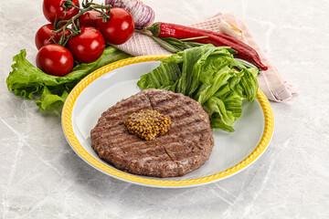 Frilled beef burger cutlet with iceberg