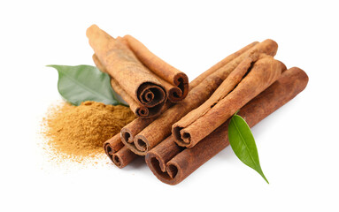 Dry aromatic cinnamon sticks, powder and green leaves isolated on white