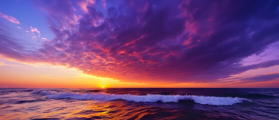 Panorama of Beautiful view sunset sky over sea, Colorful dramatic majestic scenery sunset Sky with Amazing clouds and waves in sunset sky purple light cloud background