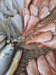 Various kinds of dried fishes on the woven colander - Traditional Korean food	