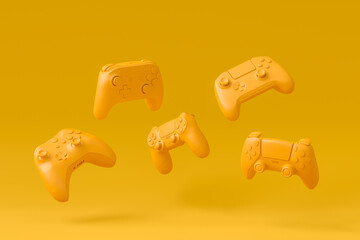 Set of flying gamer joysticks or gamepads on monochrome background