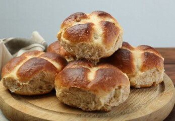 Tasty hot cross buns on table, closeup