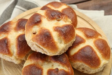 Tasty hot cross buns on table, closeup