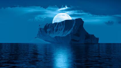 Melting icebergs by the coast of Greenland with Full moon over the sea - Greenland 