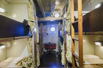 View into bunk bed multi person shared oceanview cabin stateroom onboard historic classic ocean...
