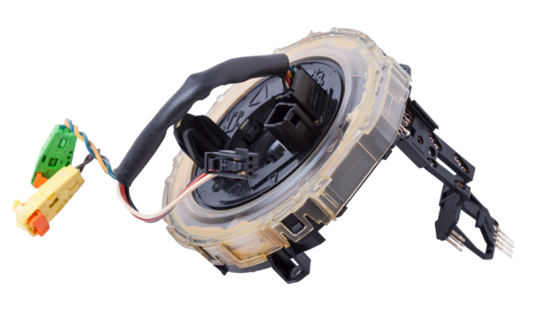 Steering angle sensor disassembled on a white isolated background, spare part for car repair or for sale at junk yard.