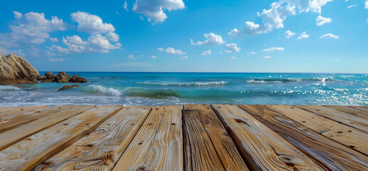 Wooden deck perspective of tranquil beach and clear sky