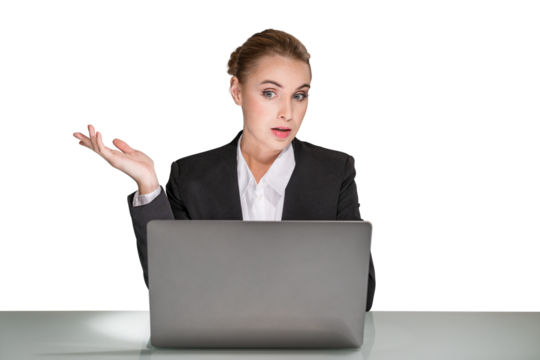 Confused businesswoman at a laptop with a questioning gesture, isolated on a white background, representing problem-solving