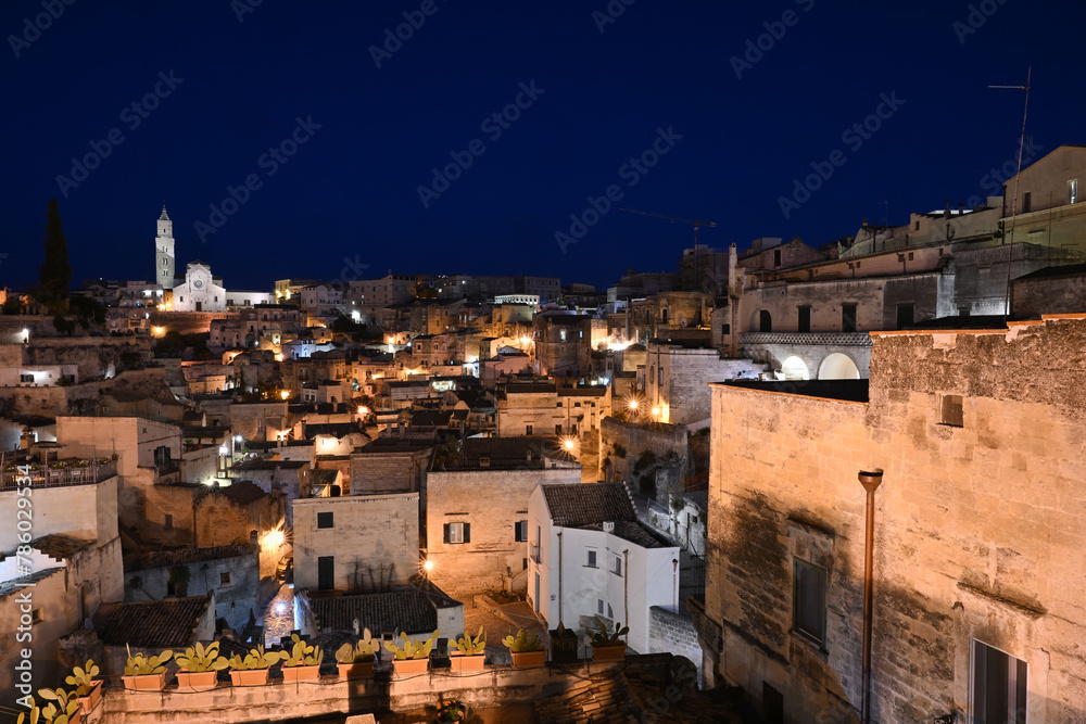 Wall mural Matera Italy view of ancient village of Matera Sasso Barisano at dusk