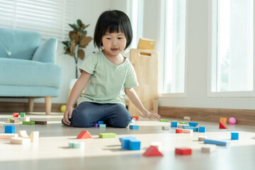 Happy Asia children play and learn toy blocks.family is happy and excited in the house. daughter...