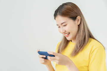 Fototapeta premium excited young woman play games by mobile phone make winner gesture. female winning mobile gambling. Wow face expression. Esport streaming game online, surprise, gamer, online, earning, new generation