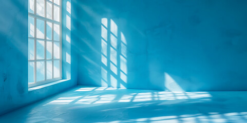 A blue room with a window and a blue wall