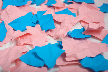 Crumpled and torn pieces of pink and blue paper. Background, texture