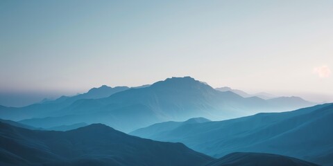 Serene scenic view of gentle misty mountain ranges in the soothing morning light