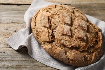 Freshly baked sourdough bread on wooden table