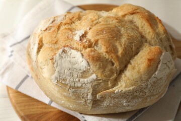 Freshly baked sourdough bread on white table