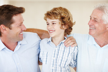 Boy, love and hug for dad or grandpa in home, support and happy for together generations in lounge....