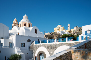 Panoramic view of traditional white architecture with churches, greek village of Thira village, Santorini, Greece