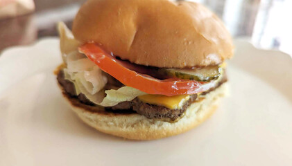Fresh homemade hamburger with salad. Yummy fast food concept. Fresh homemade grilled burger with meat patty.	
