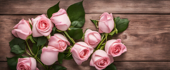 Bunch bouquet of pink roses and wooden heart on rustic wooden table - Flower background panorama banner 