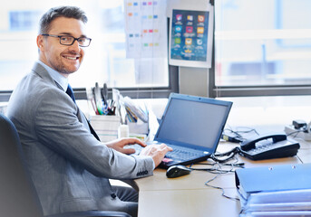 Businessman, portrait and laptop in office for planning, internet and email in workplace for career. Corporate, professional and brainstorming for startup company, technology and global enterprise. - obrazy, fototapety, plakaty