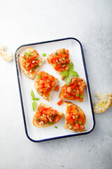Traditional tomato bruschetta with greens