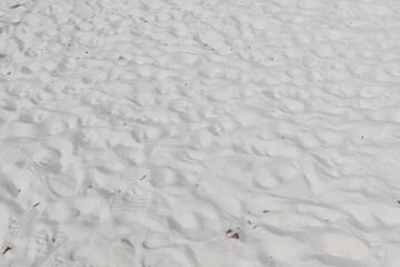 Fine white sand that glistens and reflects the sunlight.