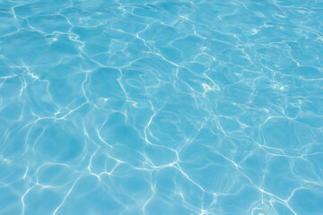 The light reflects blue in the water in the swimming pool. It looks fresh and lively, suitable for use as a wallpaper.