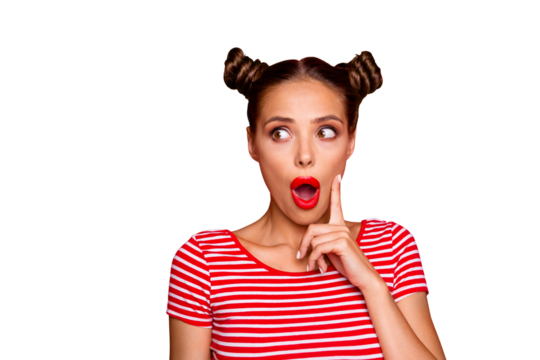OMG! Close up face of shocked astonished girl with modern hairdo having wide open mouth and brown eyes looking at camera and to touch her cheek by finger isolated on red background with copyspace