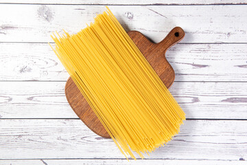 Raw dry spaghetti  italian pasta on table.