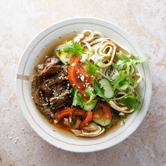 Traditional Korean soup with noodles and beef