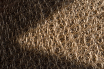 Background or texture of Natural eco-friendly Brown jute washcloth. Closeup.