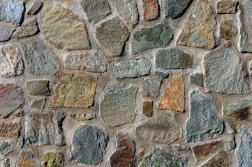 Stone wall of natural stones. Brickwall texture background