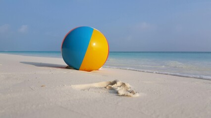 Closeup shot of a ball at the beach in the Maldives