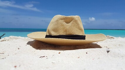 Closeup of a hat at a beach on a summer sunny day
