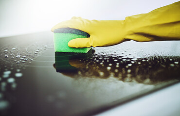 Surface, cleaning or hands of person with sponge or gloves in kitchen in home for healthy hygiene....
