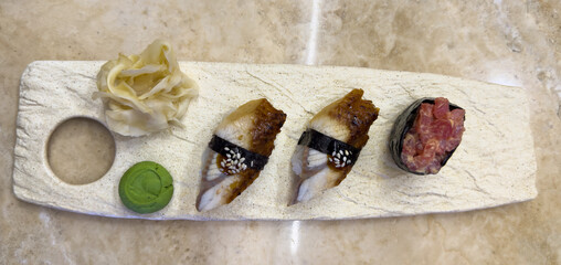 Nigiri sushi on marble plate. Delicious eel nigiri sushi.